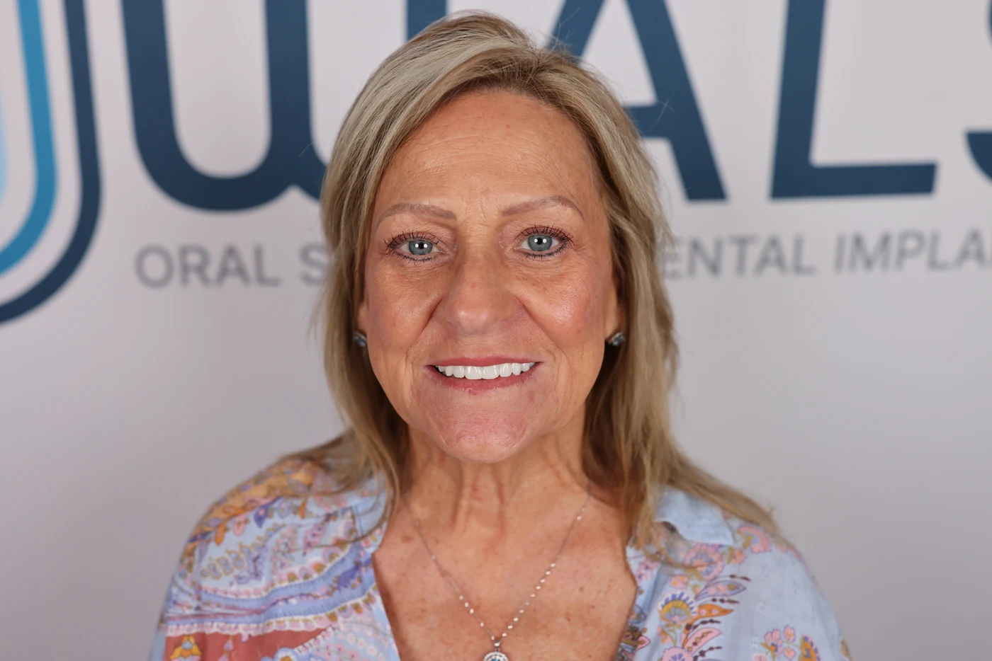 Patient smile after full-arch dental implant treatment, patient case 07